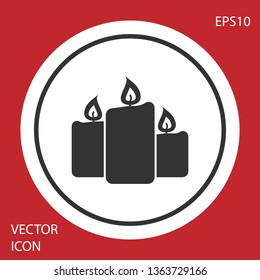 Grey Burning candles icon isolated on red background. Old fashioned lit candles. Cylindrical aromatic candle sticks with burning flames. Circle button. Vector Illustration
