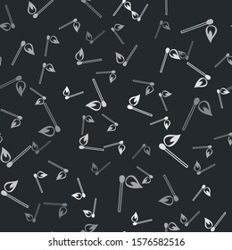 Grey Burning match with fire icon isolated seamless pattern on black background. Match with fire. Matches sign.  Vector Illustration