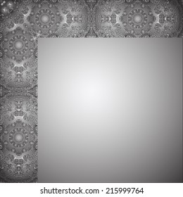 Grey card with vertical white and black ornament to the left and horizontal one in upper part