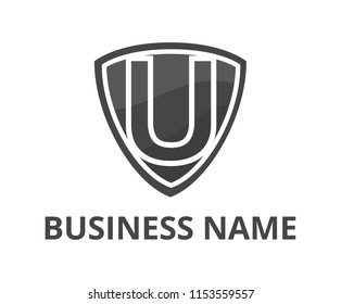 grey color simple triangle shield logo graphic design with modern clean style for protection or security company with initial type letter U on it