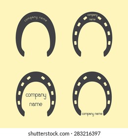 Grey colored horseshoes logos isolated on flaxen background