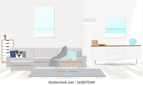 Grey corner sofa in fashionable white interior of the living room.