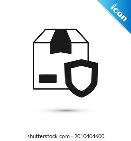 Grey Delivery security with shield icon isolated on white background. Delivery insurance. Insured cardboard boxes beyond the shield.  Vector