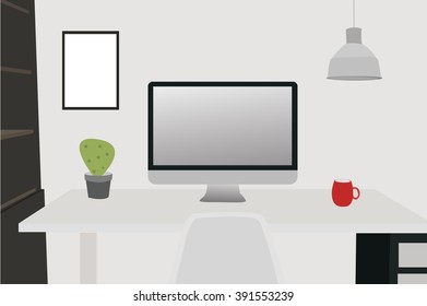 grey desktop with red cup, computer, picture on a wall 