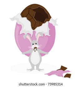 Grey Easter Bunny attempting to hide a large chocolate Easter egg that he's taken a bite out of.