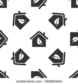 Grey Eco friendly house icon isolated seamless pattern on white background. Eco house with leaf. Vector Illustration