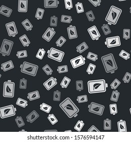 Grey Eco nature leaf and battery icon isolated seamless pattern on black background. Energy based on ecology saving concept.  Vector Illustration