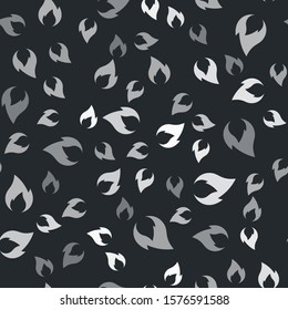 Grey Fire flame icon isolated seamless pattern on black background. Heat symbol.  Vector Illustration