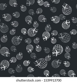 Grey Globe with flying plane icon isolated seamless pattern on black background. Airplane fly around the planet earth. Aircraft world icon.  Vector Illustration