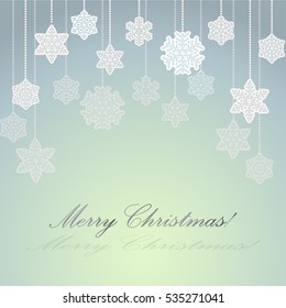 Grey and green background with paper snowflakes on a string of beads for greeting cards for  Christmas