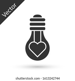 Grey Heart shape in a light bulb icon isolated on white background. Love symbol. Valentine day symbol.  Vector Illustration