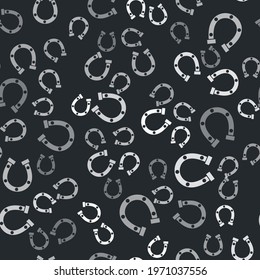 Grey Horseshoe icon isolated seamless pattern on black background.  Vector