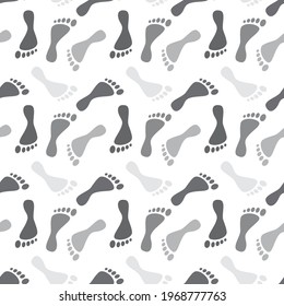 Grey human footprints silhouette paths on white background. Clip-art vector illustration. Seamless pattern.