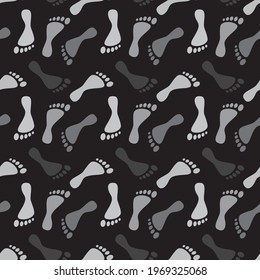 Grey human footprints silhouette paths on black background. Clip-art vector illustration. Seamless pattern.