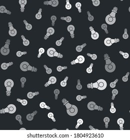 Grey Human head with lamp bulb icon isolated seamless pattern on black background. Vector.