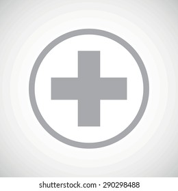 Grey image of cross in circle, on white gradient background
