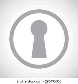 Grey image of keyhole in circle, on white gradient background