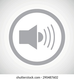 Grey image of loudspeaker in circle, on white gradient background