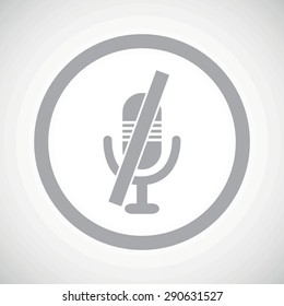 Grey image of muted microphone in circle, on white gradient background