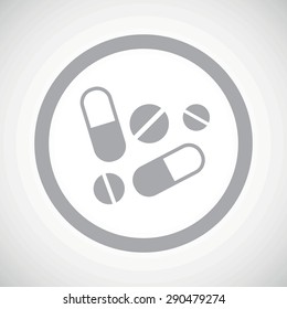 Grey image of pills and tablets in circle, on white gradient background