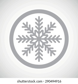 Grey image of snowflake in circle, on white gradient background