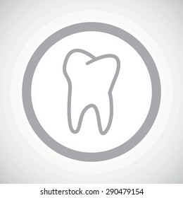 Grey image of tooth in circle, on white gradient background