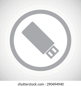 Grey image of USB flash drive in circle, on white gradient background