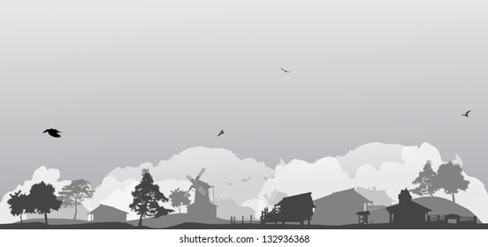 grey landscape with trees and village