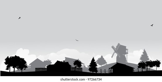 grey landscape with trees and village