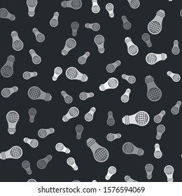 Grey Light bulb with inside world globe icon isolated seamless pattern on black background. Planet Earth on the lamp. Global ecology concept.  Vector Illustration
