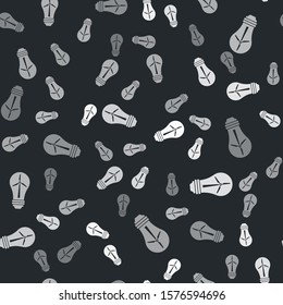 Grey Light bulb with wind turbine as idea of eco friendly source of energy icon isolated seamless pattern on black background. Alternative energy concept.  Vector Illustration