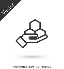 Grey line Honeycomb and hand icon isolated on white background. Honey cells symbol. Sweet natural food. Vector