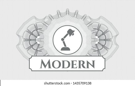 Grey linear rosette with desk lamp icon and Modern text inside
