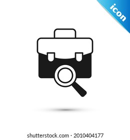 Grey Magnifying glass with briefcase icon isolated on white background. Job hunting. Work search concept. Unemployment, head hunting, career.  Vector