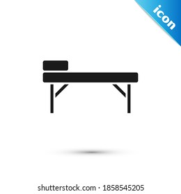Grey Massage table icon isolated on white background.  Vector