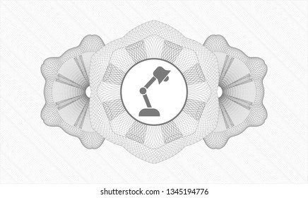 Grey money style rosette with desk lamp icon inside