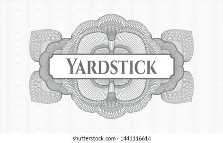 Grey money style rosette with text Yardstick inside