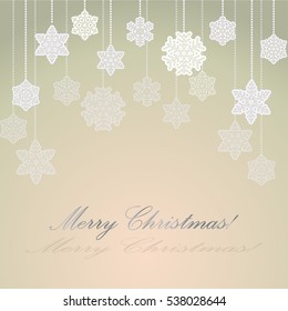 Grey and orange background with paper snowflakes on a string of beads for greeting cards for  Christmas