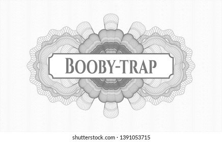 Grey passport money rosette with text Booby-trap inside