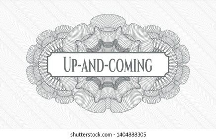 Grey passport money rosette with text Up-and-coming inside