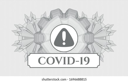 Grey passport money style rosette with warning icon and COVID-19 text inside
