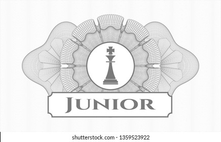 Grey passport rosette with chess king icon and Junior text inside