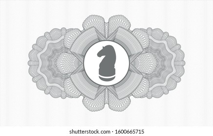 Grey passport style rosette with chess knight icon inside