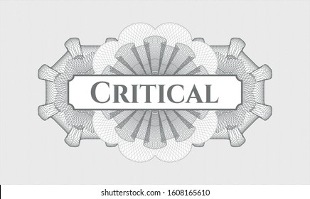 Grey passport style rosette with text Critical inside