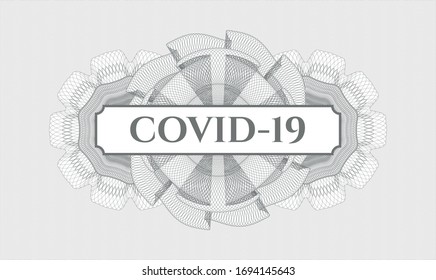 Grey passport style rosette with text COVID-19 inside