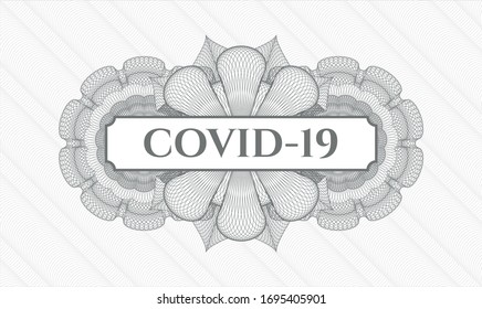 Grey passport style rosette with text COVID-19 inside