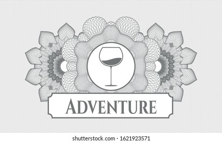 Grey passport style rosette with wine cup icon and Adventure text inside