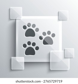 Grey Paw print icon isolated on grey background. Dog or cat paw print. Animal track. Square glass panels. Vector