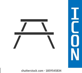Tabla de Picnic gris con bancos a ambos lados del icono de la mesa aislados en fondo blanco.  Vector