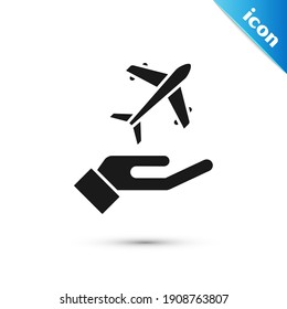 Grey Plane in hand icon isolated on white background. Flying airplane. Airliner insurance. Security, safety, protection, protect concept.  Vector